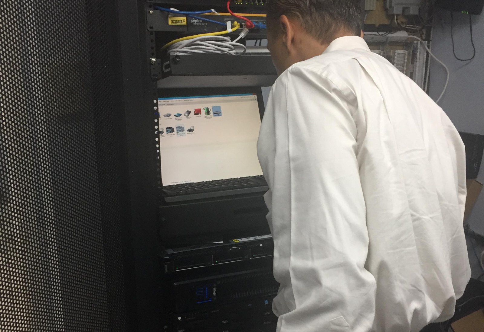 Mor@tek technician working on server rack systems